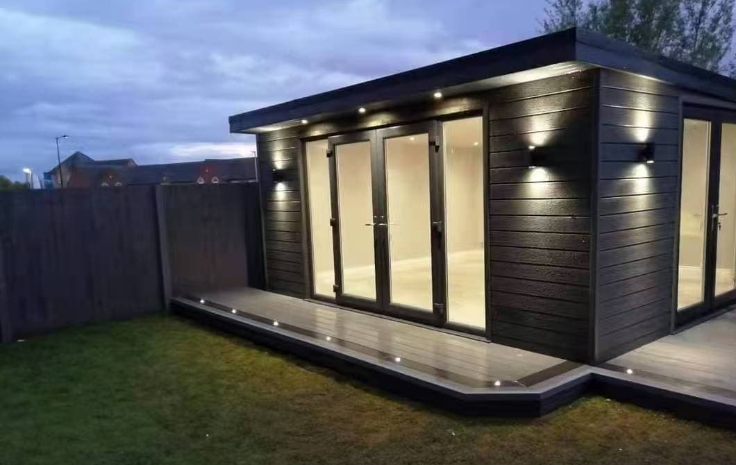 Modern exterior showcasing matching WPC cladding and fencing